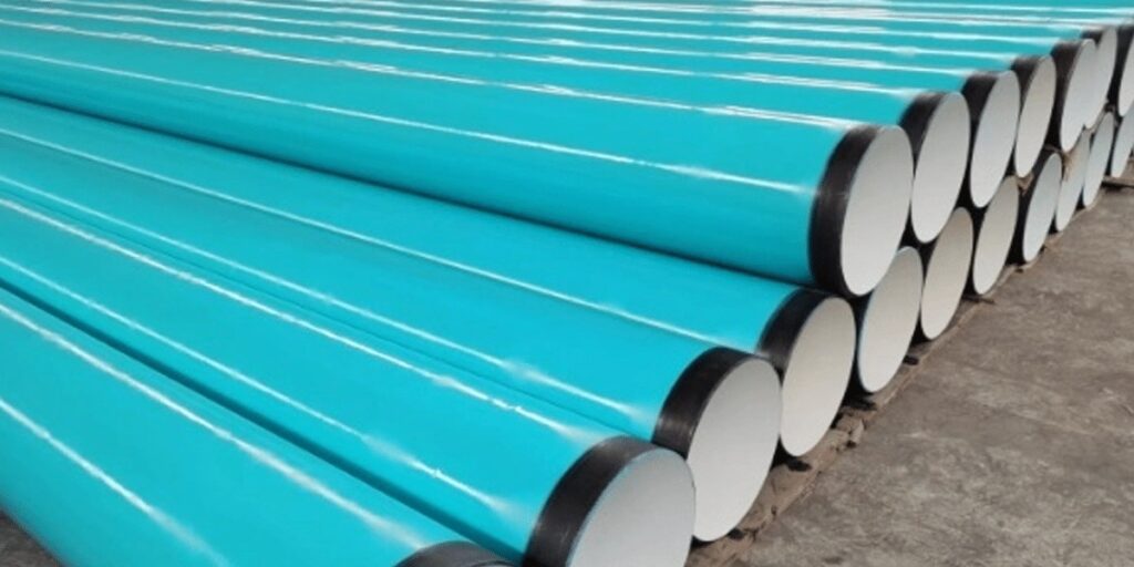 FBE coated steel pipes stacked in warehouse