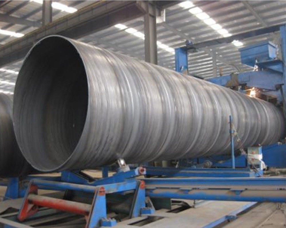 Large diameter welded pipe on finishing rack in plant
