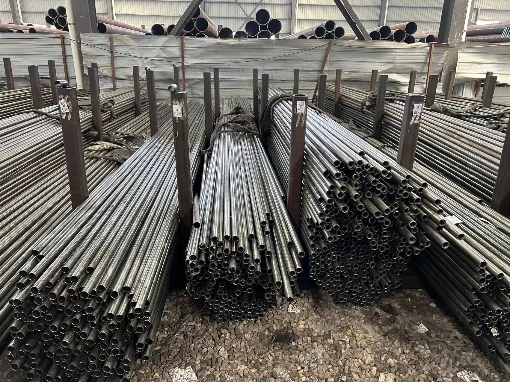 Long thin-wall steel tubes in bundles at a warehouse